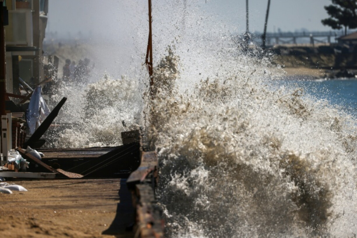 Waves have battered the boardwalk and beachfront houses in Long Beach
