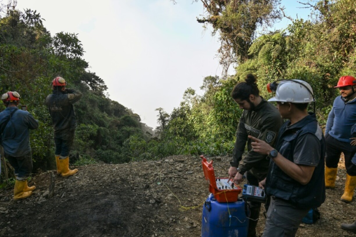 A crew prepares to set off an explosion that will put the gold mine out of operation
