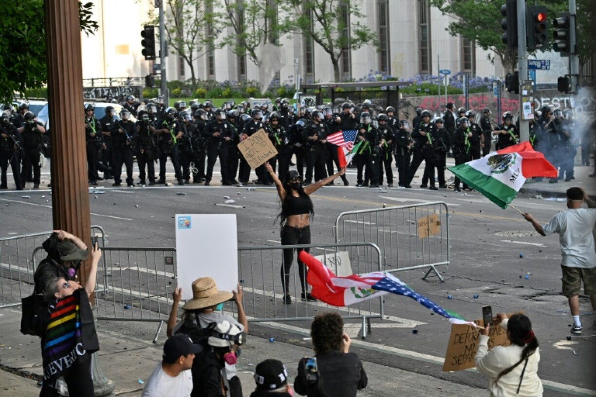 The AFP photographer was injured as police moved to clear protesters in Los Angeles