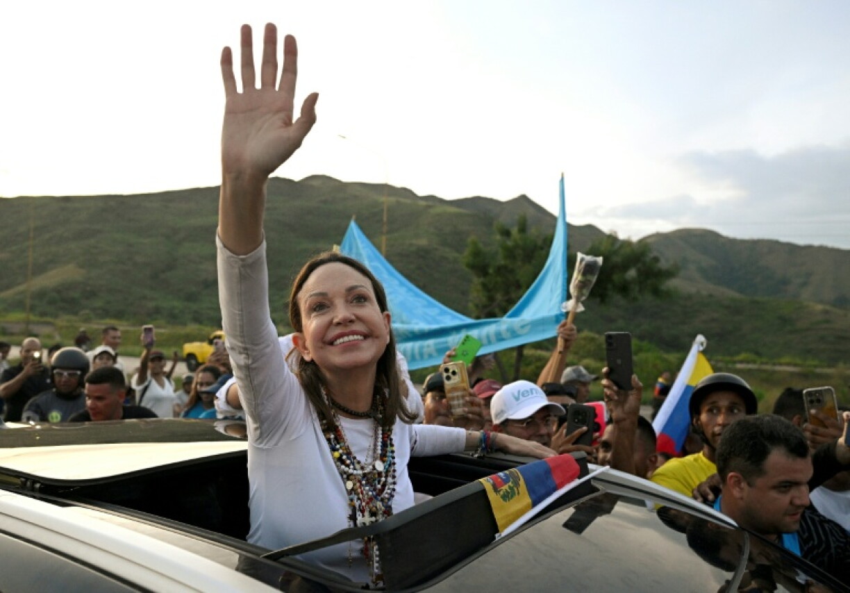Venezuelan opposition leader and Nobel Peace Prize laureate Maria Corina Machado greets supporters after her return from exile to her homeland