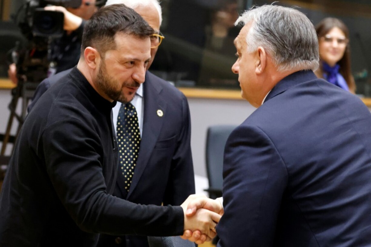 Hungary's Prime Minister Viktor Orban (R) regularly breaks EU unity on Ukraine