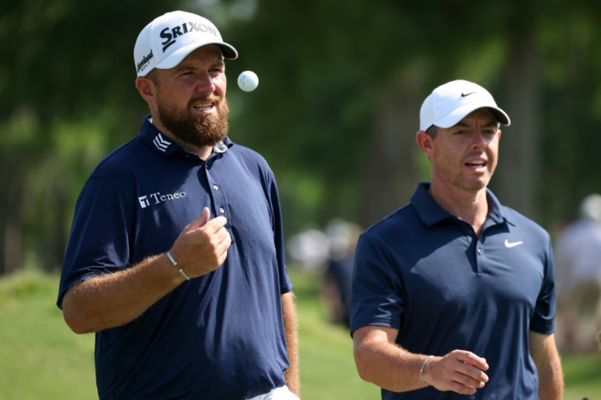 Defending champions Shane Lowry, left, and Rory McIlroy, right, combined to fire a 69 to move into contention after two rounds of the PGA Zurich Classic