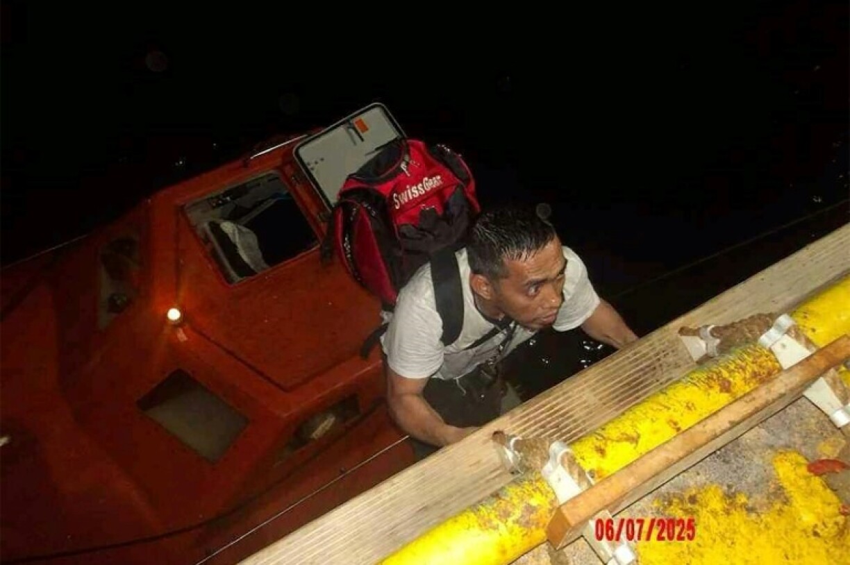 A handout picture from the UAE showing the crew of the Magic Seas being rescued by an Emirati ship