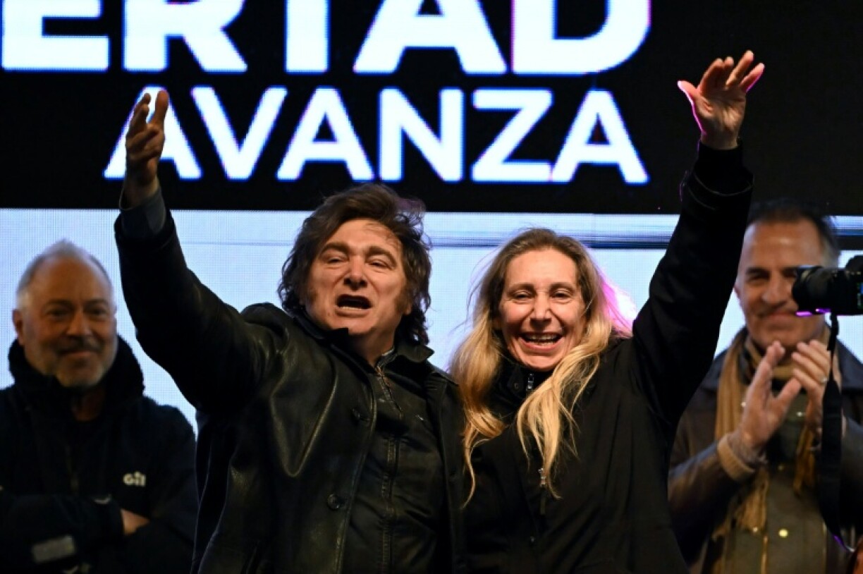 Argentina's President Javier Milei (L) and his sister, Secretary General of the Presidency Karina Milei (R), gesture during the closing rally of the La Libertad Avanza political party for the provincial election in Moreno, Buenos Aires province