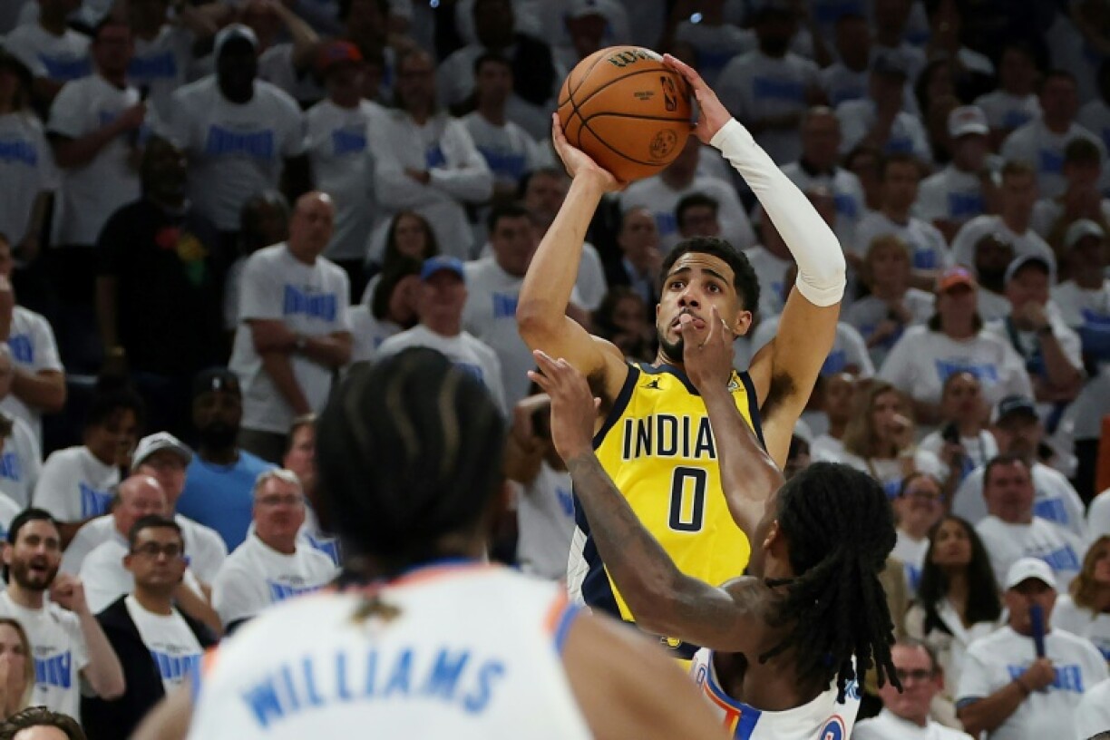 Indiana's Tyrese Haliburton shoots the winning basket with 0.3 of a second remaining to give the Pacers a dramatic victory over Oklahoma City in the first game of the NBA Finals