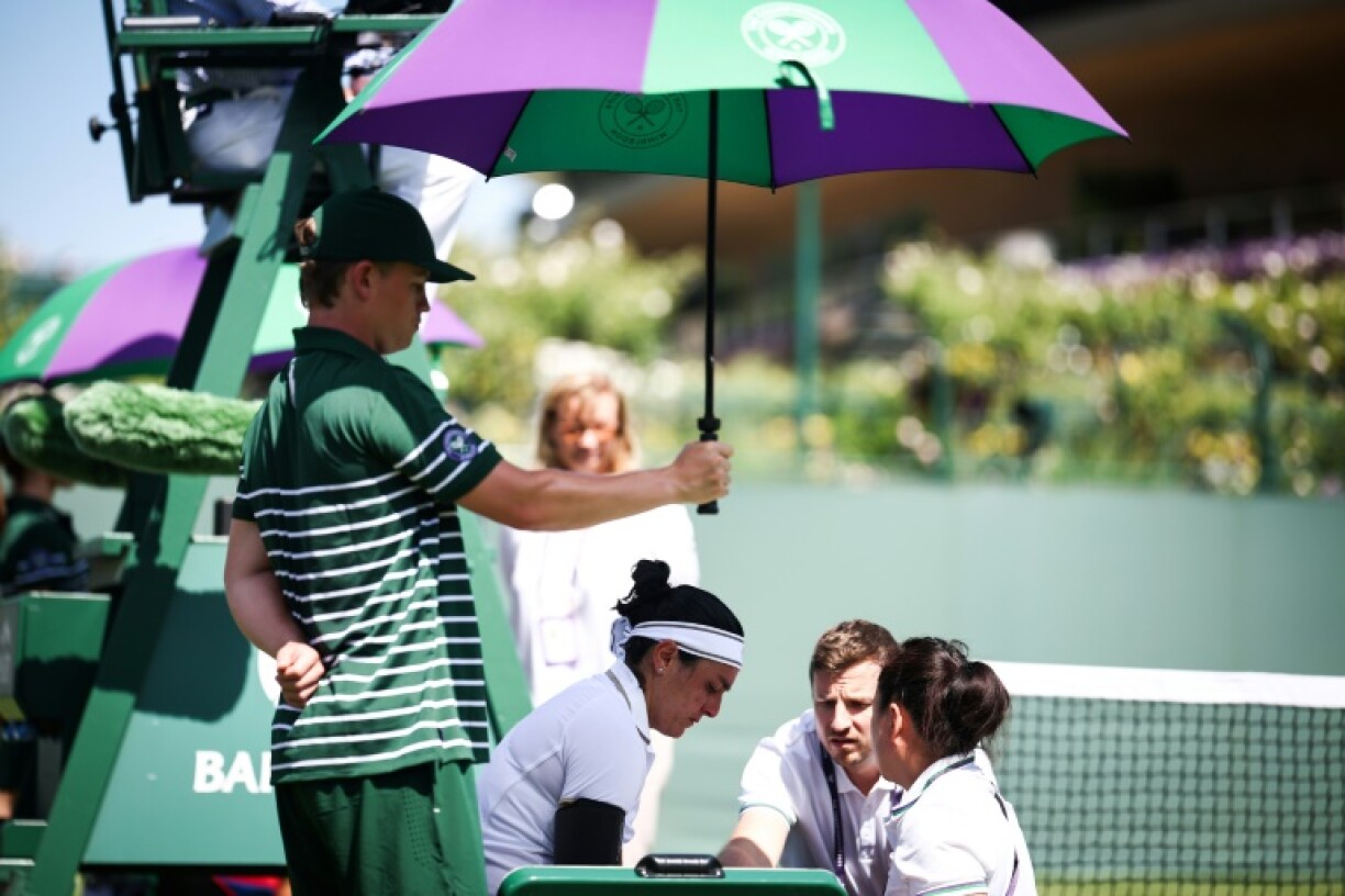 Tunisia's Ons Jabeur receives a medical treatment at Wimbledon