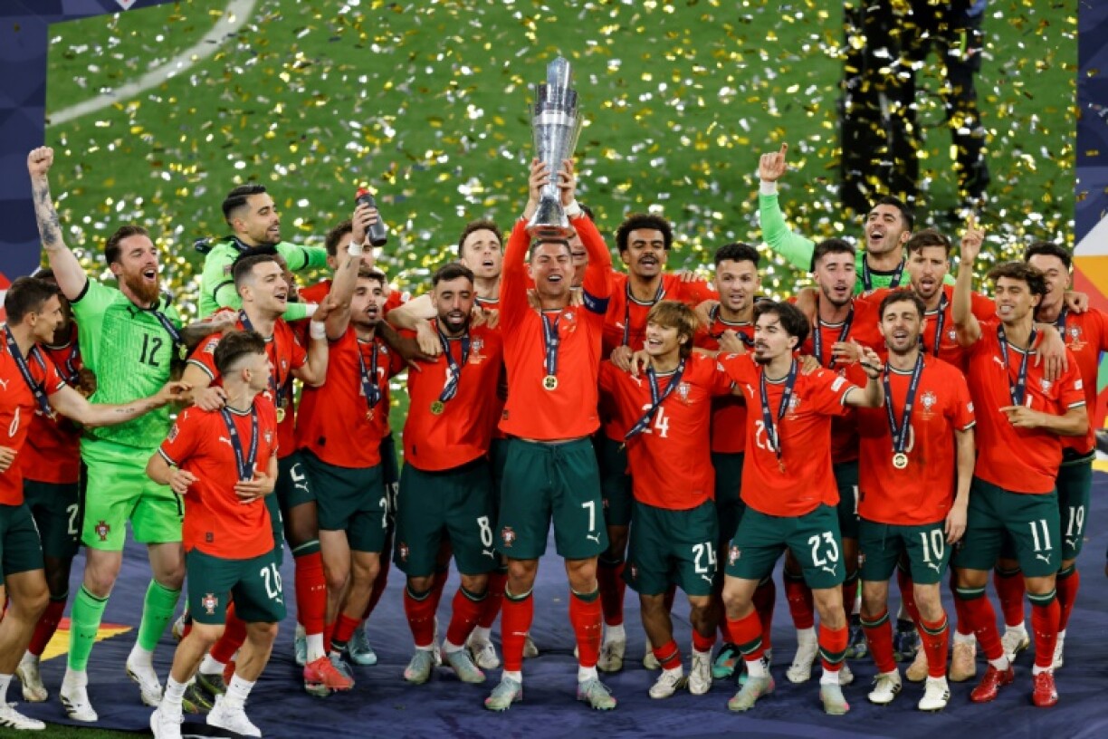 Portugal captain Cristiano Ronaldo has his team-mates behind him as he hoists the Nations League trophy