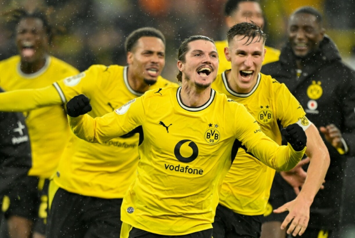 Borussia Dortmund midfielder Marcel Sabitzer (centre) celebrates after scoring the winner against Werder Bremen.