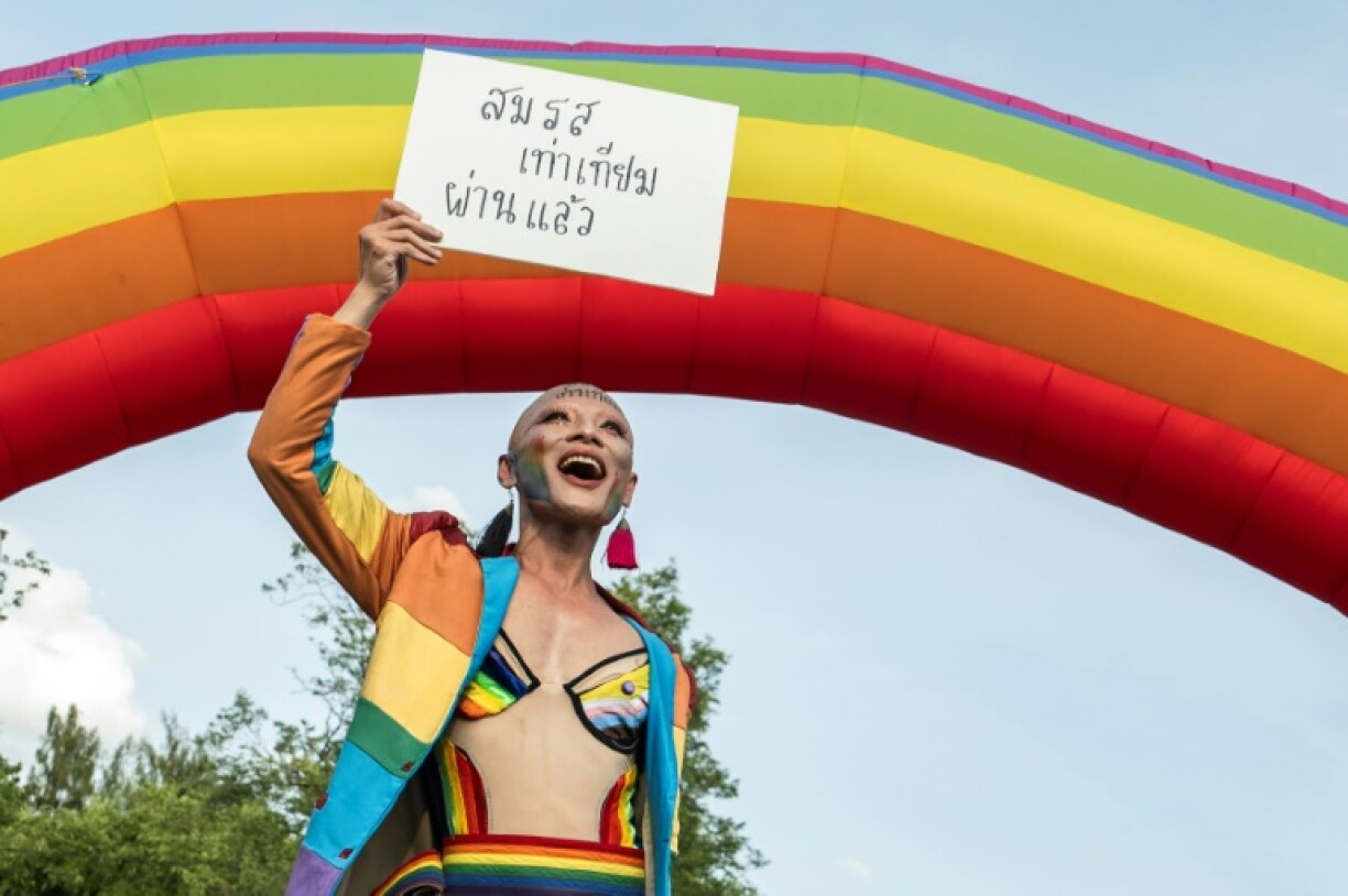 A member of the LGBTQ community celebrates after the Thai parliament passed the final senatorial vote on the same sex marriage bill on June 18, 2024