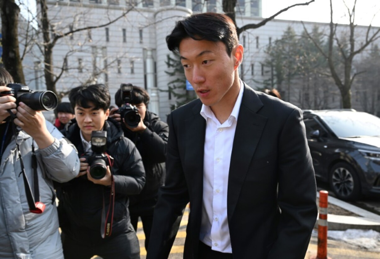 South Korean footballer Hwang Ui-jo leaves after receiving a sentence over his sex-video scandal at the Seoul Central District Court in Seoul