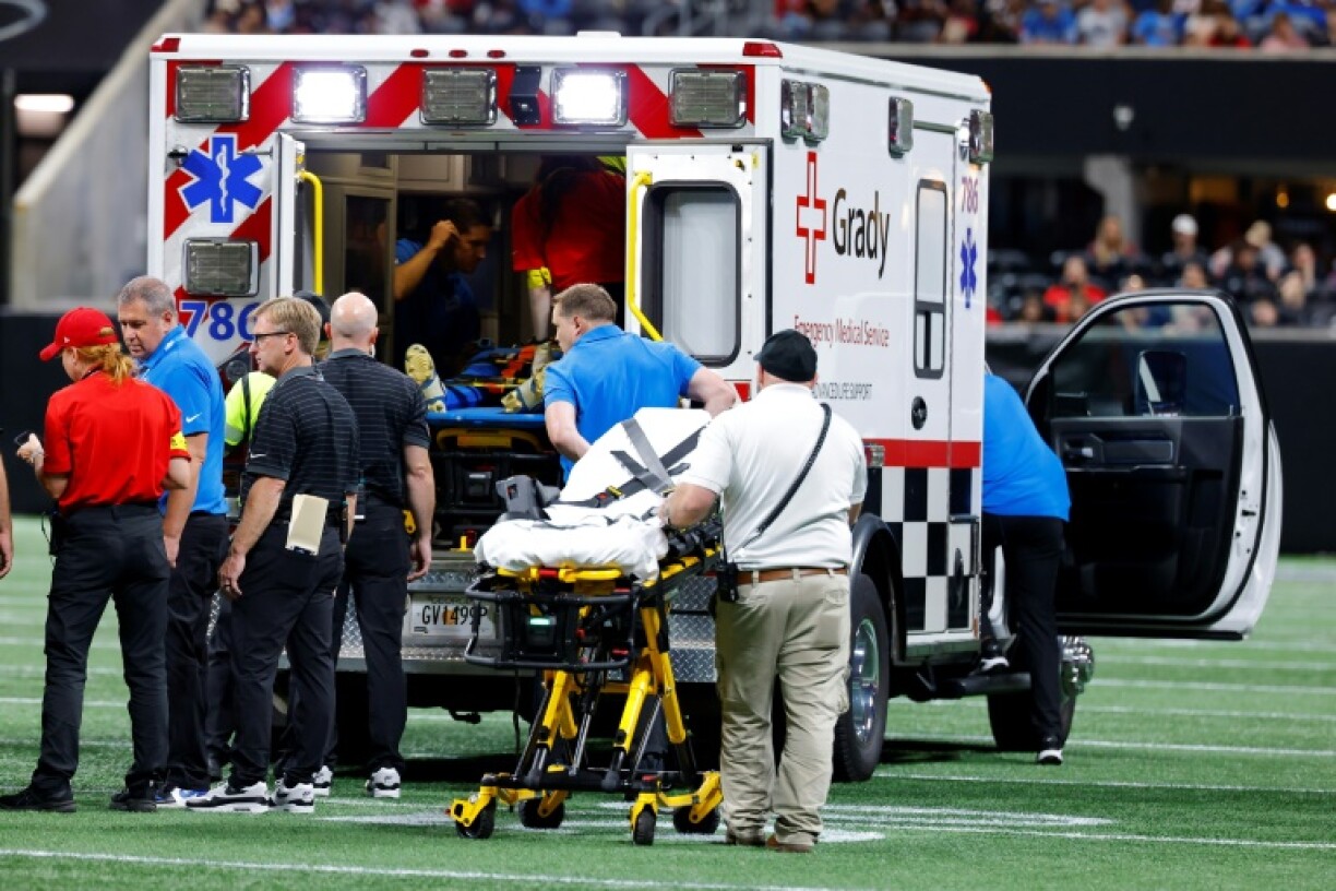 Morice Norris of the Detroit Lions is treated by medical staff during the fourth quarter of an NFL pre-season game at Atlanta before being taken to the hospital