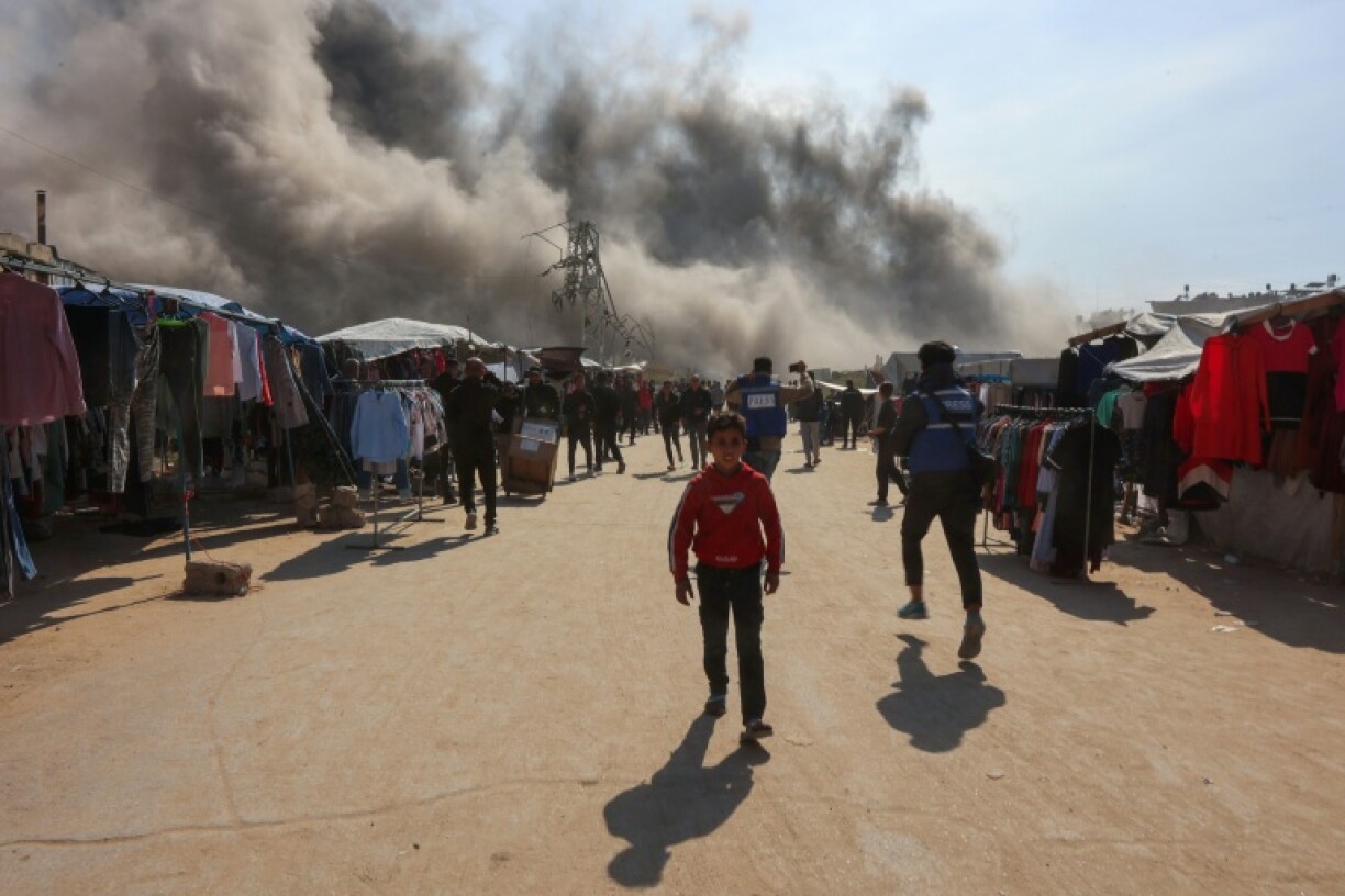 Smoke billows following an Israeli strike on a metalsmith workshop at the Zaytoun neighbourhood in Gaza City