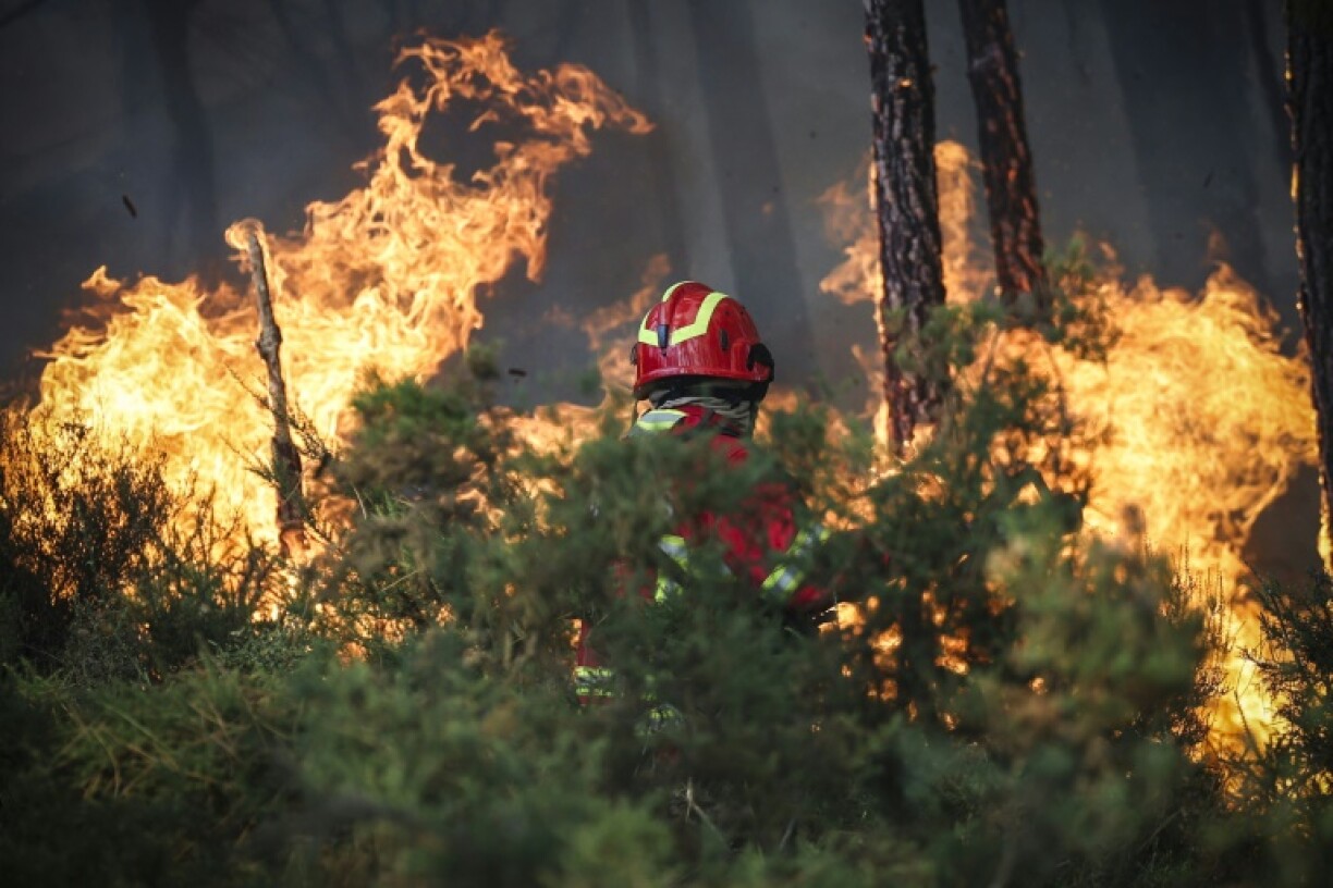 A firefighter is seen battling a wildfire burning in Gondomar, northern Portugal on July 29, 2025