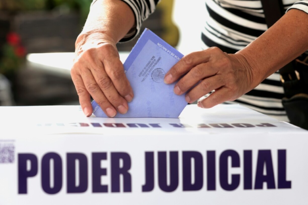 A woman casts her vote during elections making Mexico the world's only country to choose judges and magistrates at all levels through a popular vote