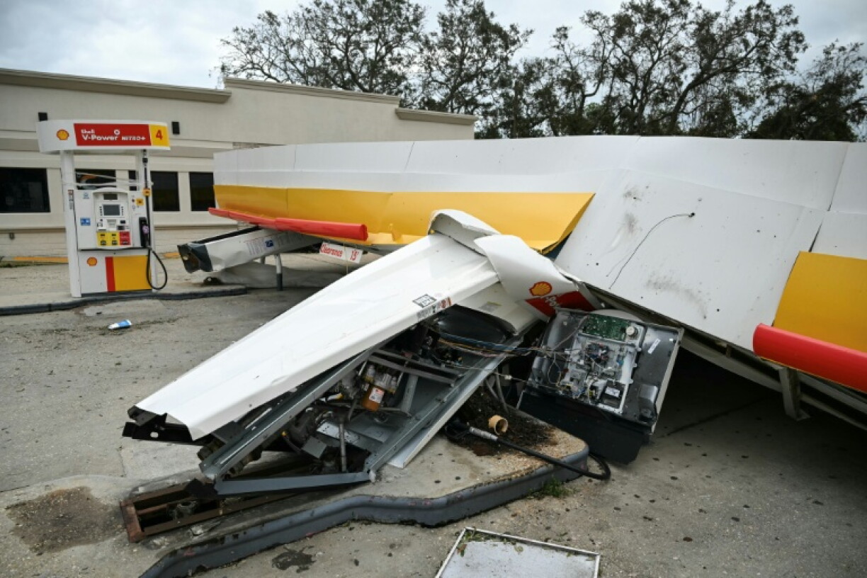 A gas station canopy collapsed in the hurricane-force winds