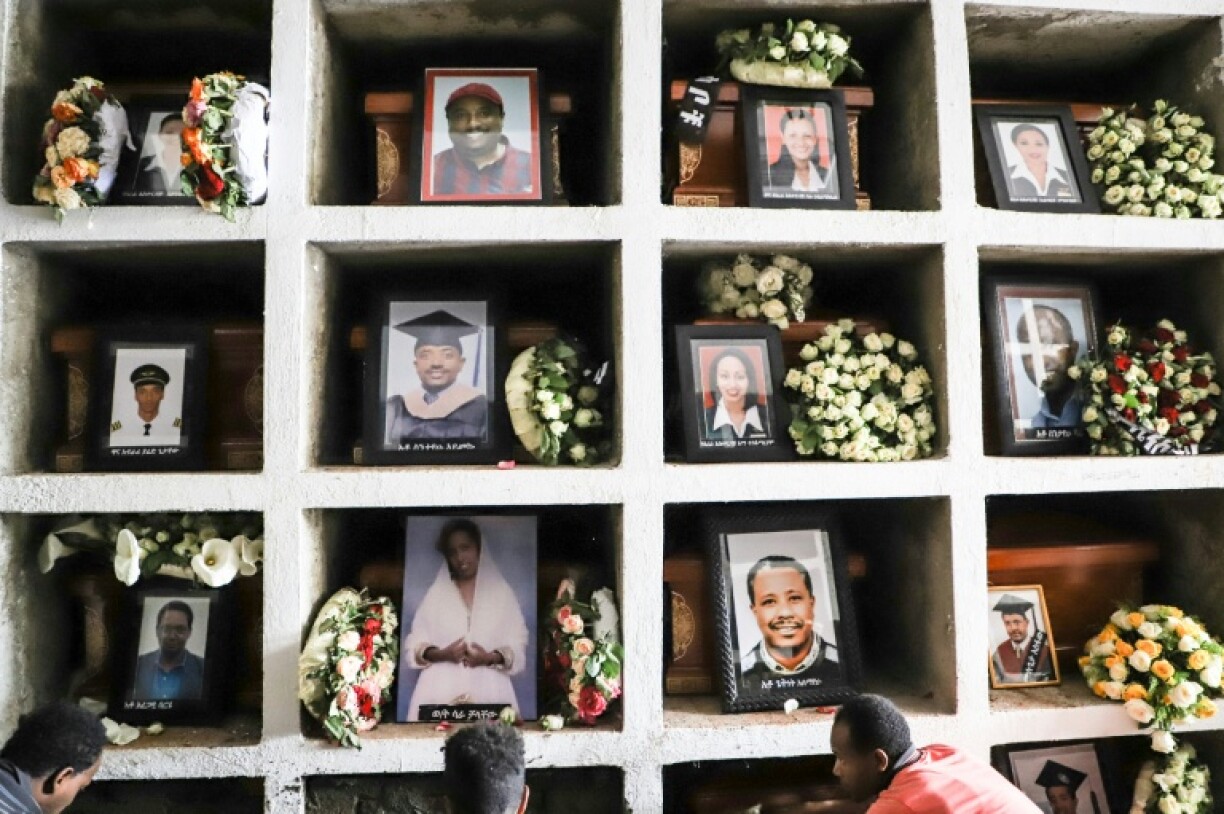 Portraits of victims of the crashed Ethiopian Airlines flight in 2019 are displayed during the mass funeral at Holy Trinity Cathedral in Addis Ababa