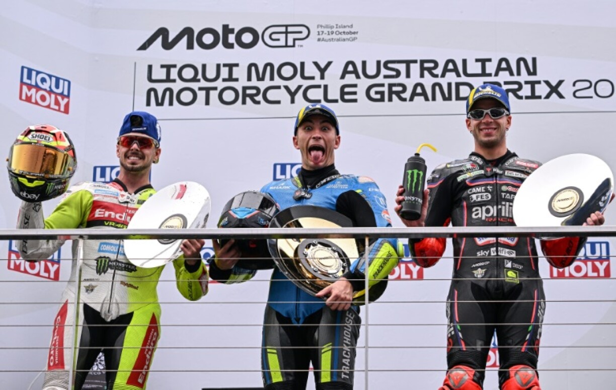 Australiam MotoGP winner Raul Fernandez (C) with second-placed Fabio Di Giannantonio (L) and third-placed Marco Bezzecchi