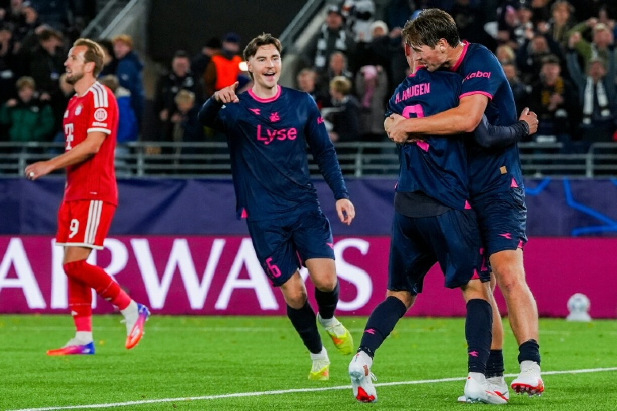 Viking defender Herman Haugen receives an embrace after scoring his team's late equaliser against Bayern Munich
