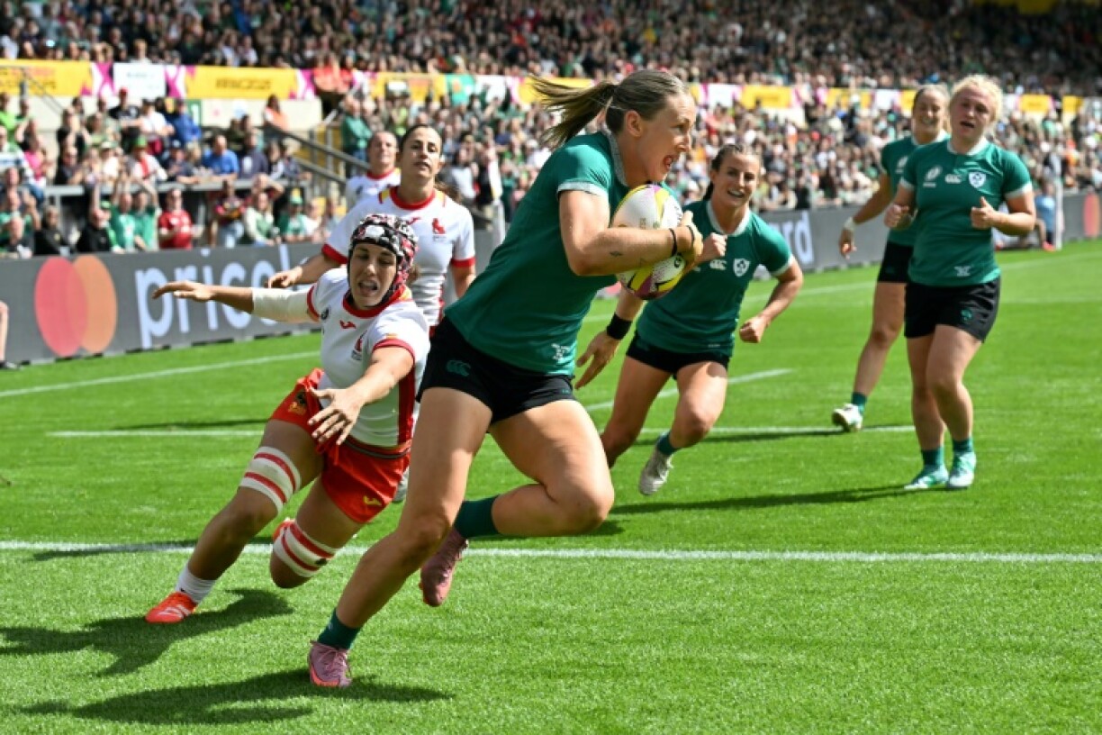 Ireland wing Anna McGann runs in a try during a 43-27 Women's Rugby World Cup Pool C win over Spain in Northampton