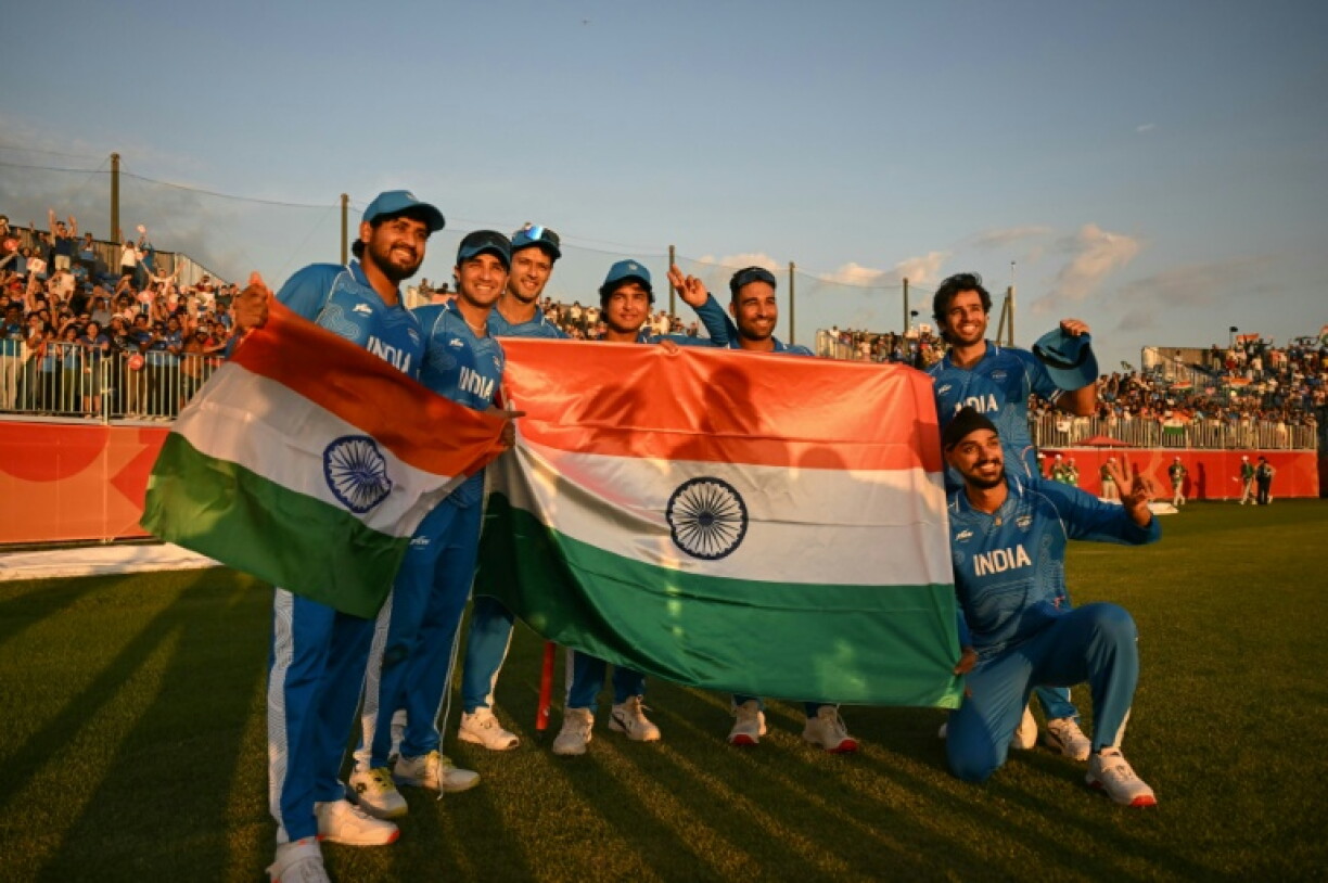 India's players celebrate their victory in the men's cricket final