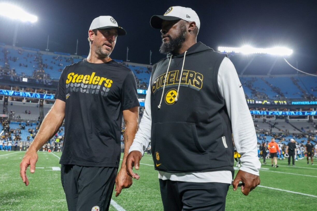 Pittsburgh quarterback Aaron Rodgers, left, and Steelers head coach Mike Tomlin, right, have united this season to boost the club's chances at being a title contender