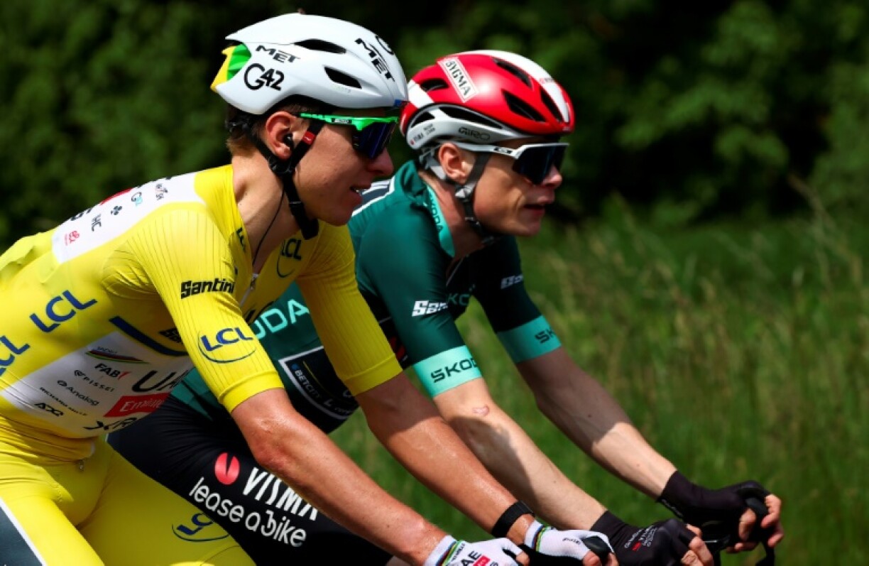 Tour rivals: Tadej Pogacar (L) wearing the leader's yellow jersey and Jonas Vingegaard during the Criterium du Dauphine