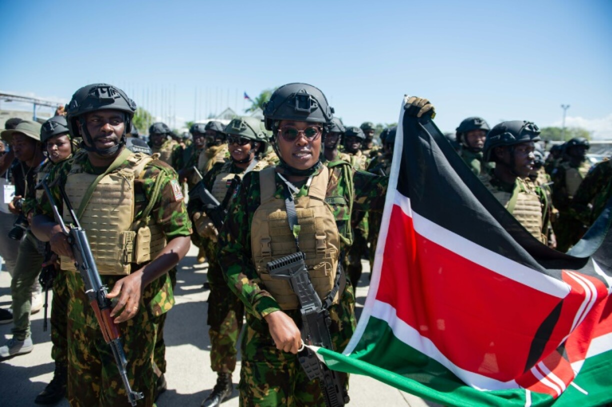 Kenyan police officers arrive at Toussaint Louverture International Airport in Port-au-Prince