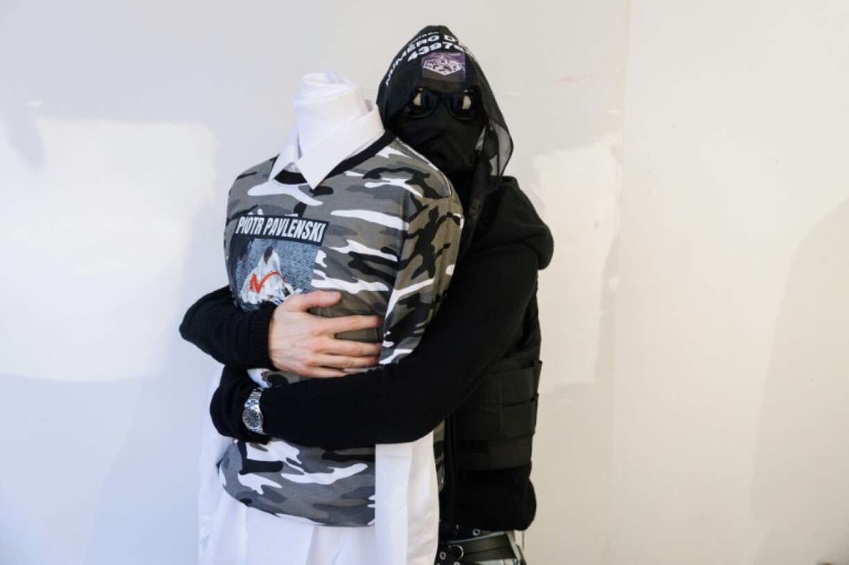 Always photographed with his face hidden, Kanoush also refuses to reveal his identity