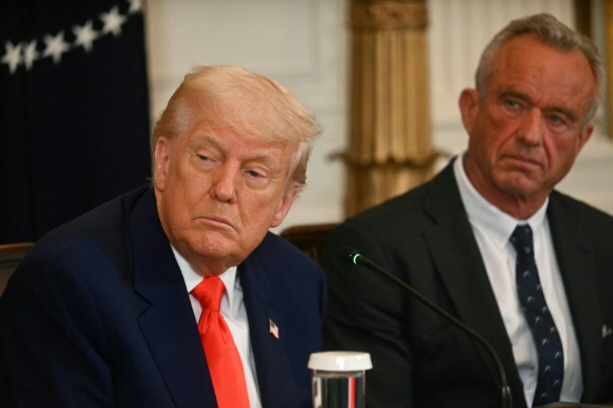 US President Donald Trump (L) and Health Secretary Robert F. Kennedy Jr. at the release of the MAHA report at the White House on May 22, 2025