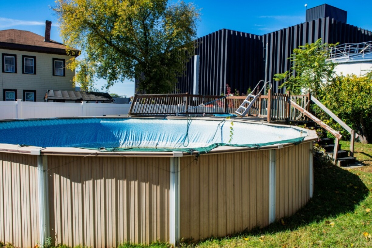 The Markley Lowell Data Center towers over resident Eileen Castle's backyard in Lowell, Massachusetts