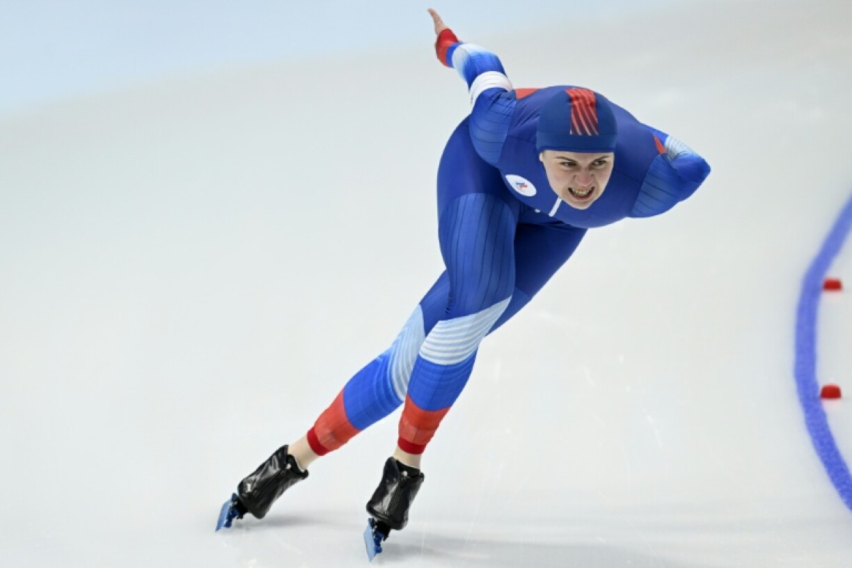 Daria Kachanova skating to ninth in the the 1000m women's speed skating in Beijing in 2022. She will be banned from the 2026 Winter Olympics