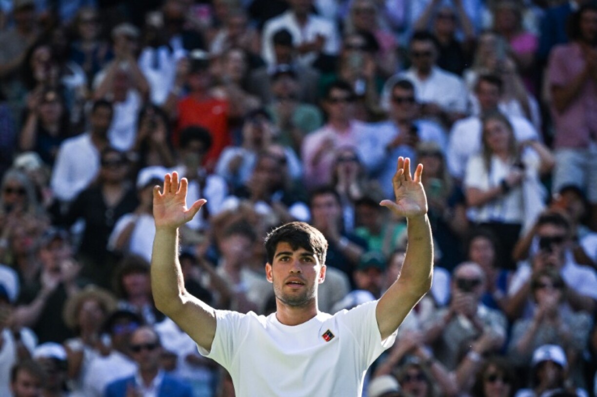 Carlos Alcaraz celebrates beating Oliver Tarvet at Wimbledon
