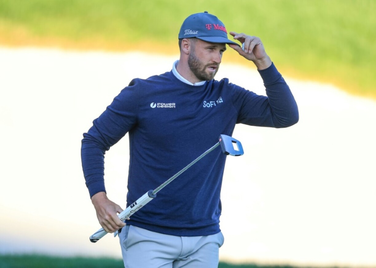 Wyndham Clark acknowledges the crowd after taking a two-shot lead at the Arnold Palmer Invitational with a birdie on the 18th