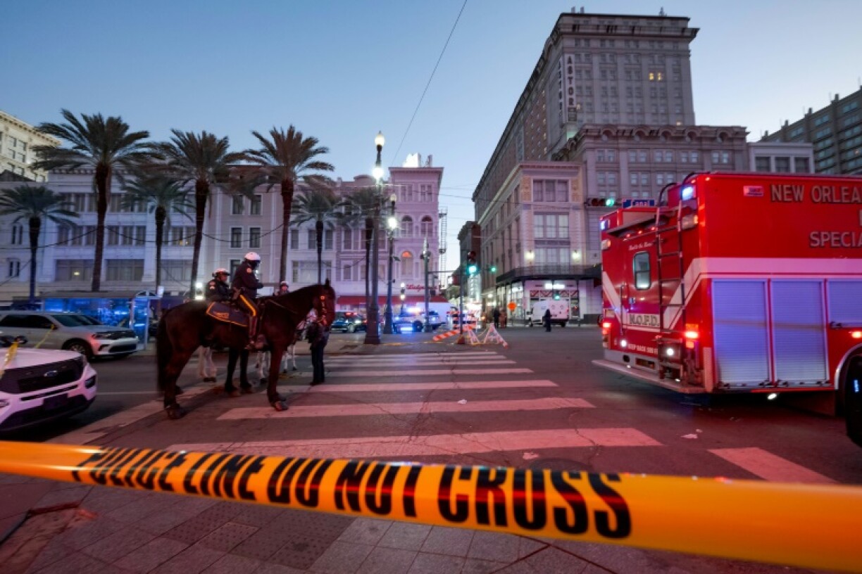 Early morning on New Year's Day as police cordon off the intersection of Canal Street and Bourbon Street in New Orleans after a truck plowed into a crowd of revellers, killing at least 15 people