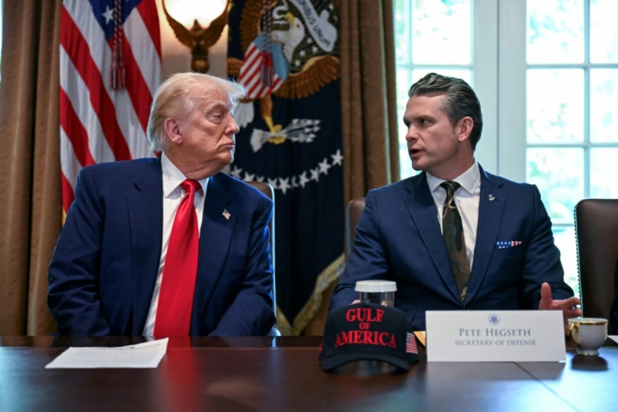 US President Donald Trump (L) and Pentagon chief Pete Hegseth are seeking to bar transgender troops from serving in the military