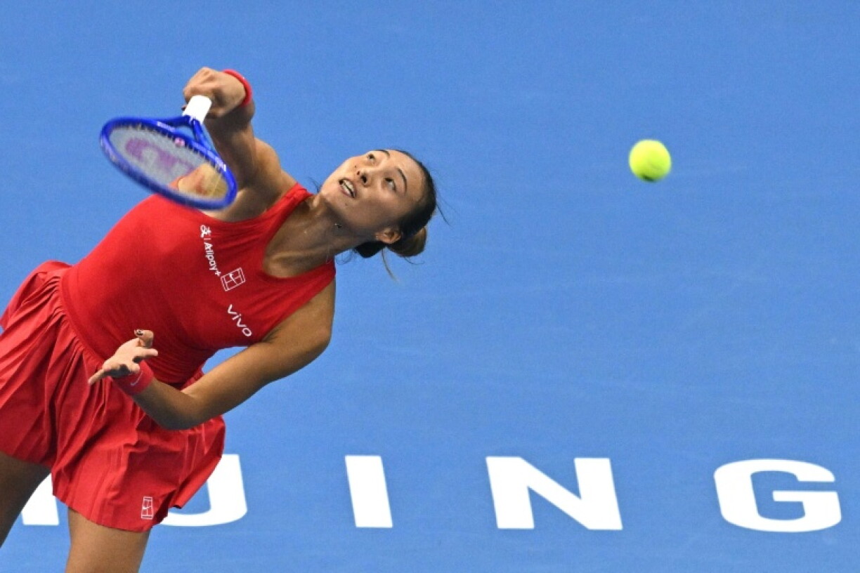 China’s Zheng Qinwen serves to Russia’s Mirra Andreeva