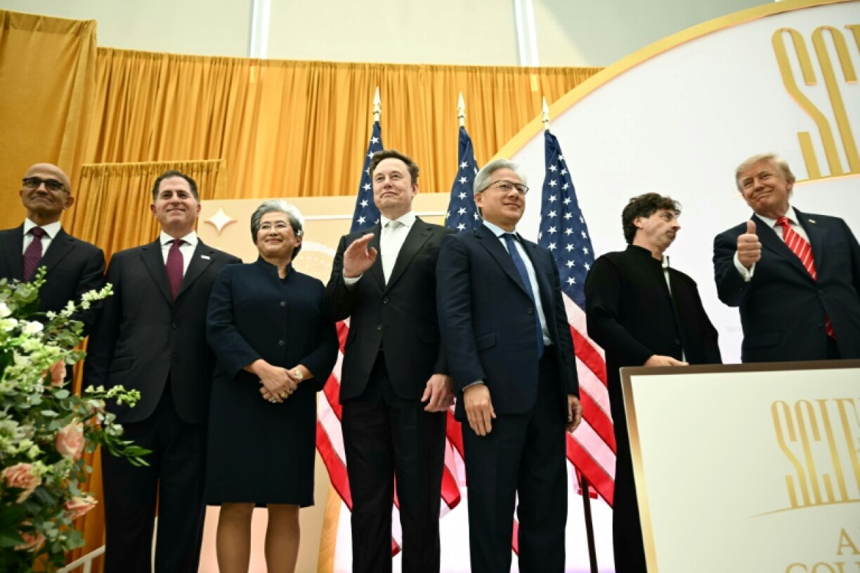 (From L) Microsoft CEO Satya Nadella, Dell Techologies CEO Michael Dell, AMD CEO Lisa Su, SpaceX CEO Elon Musk, Nvidia CEO Jensen Huang, Google co-founder Sergei Brin and US President Donald Trump appear on stage