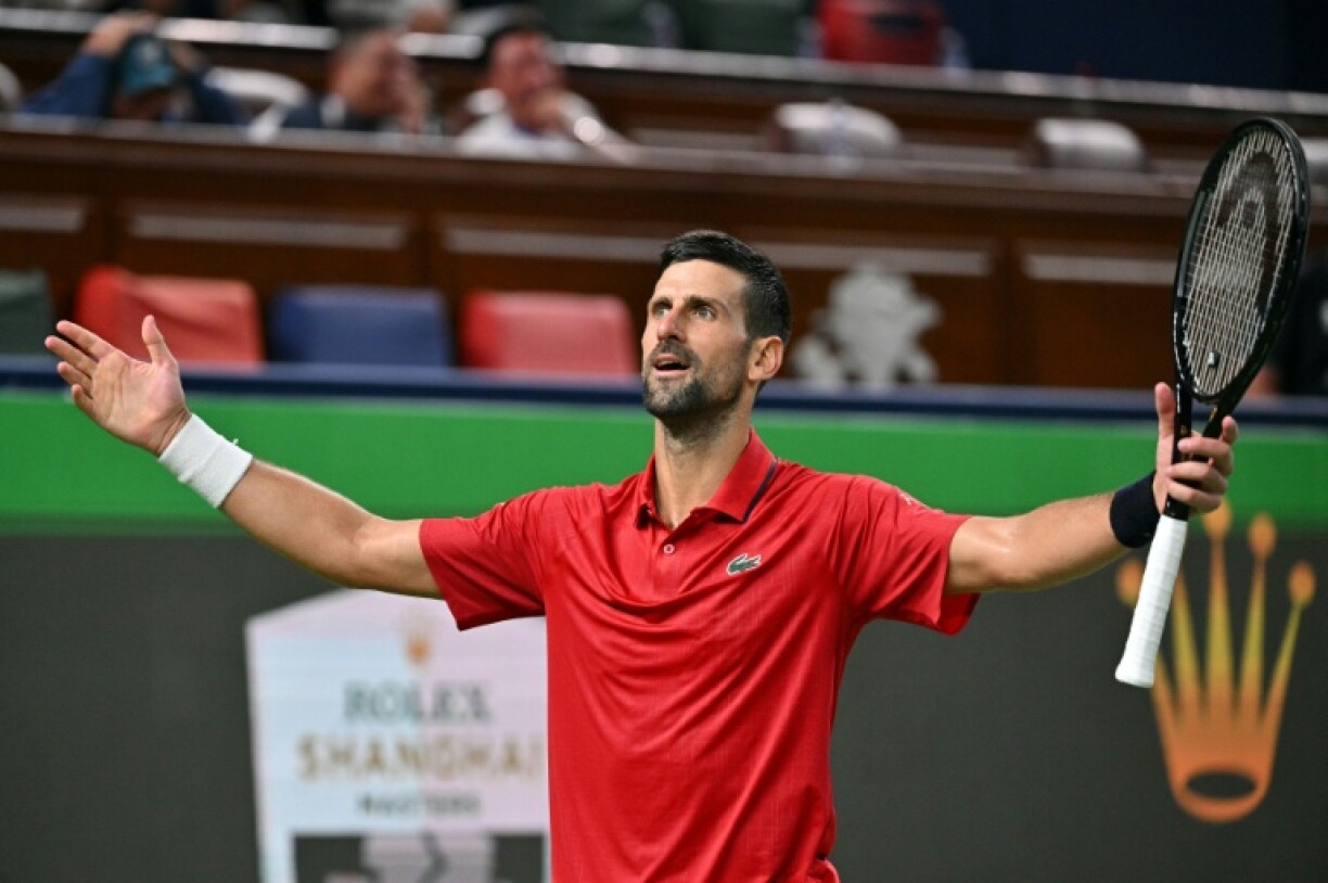 Novak Djokovic celebrates reaching the semi-finals in Shanghai