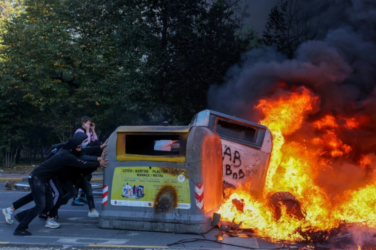 Some of the protesters set objects on fire