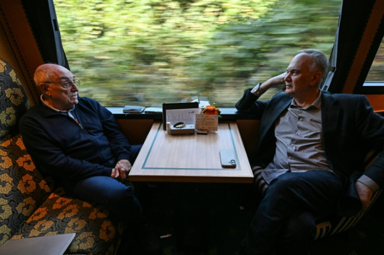 French writer Herve Le Tellier (R) described the process as akin to