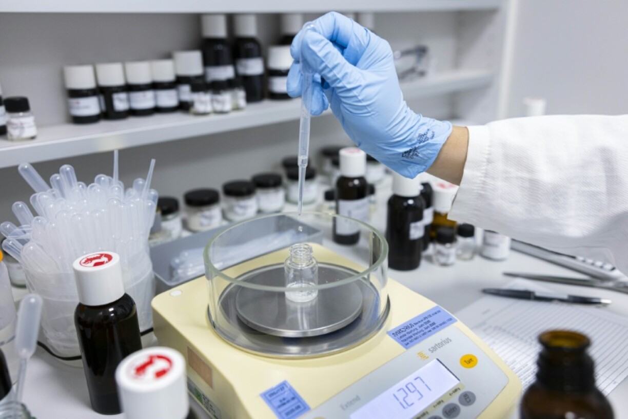 A perfume oil formula is produced in a mixing room at the Symrise company