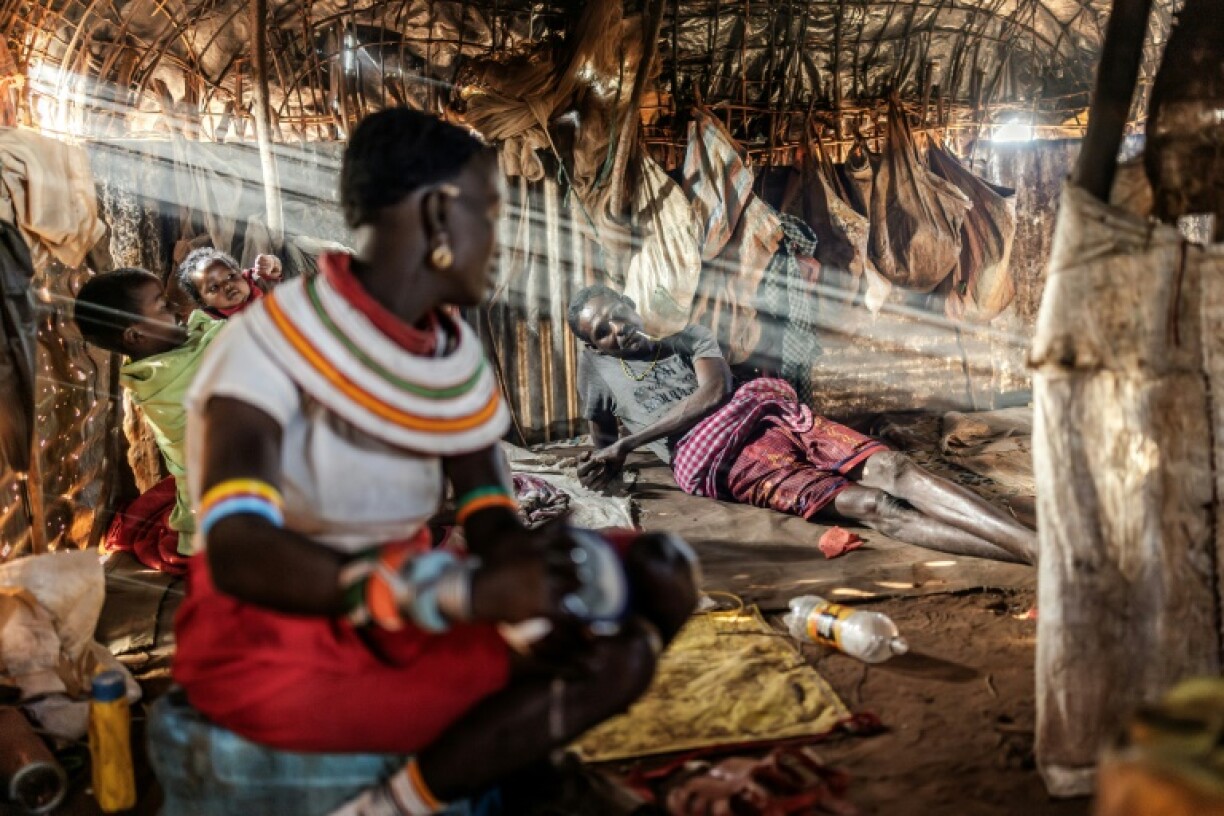 Pastoralist Chapan Lolpusike waits for some camel milk tea