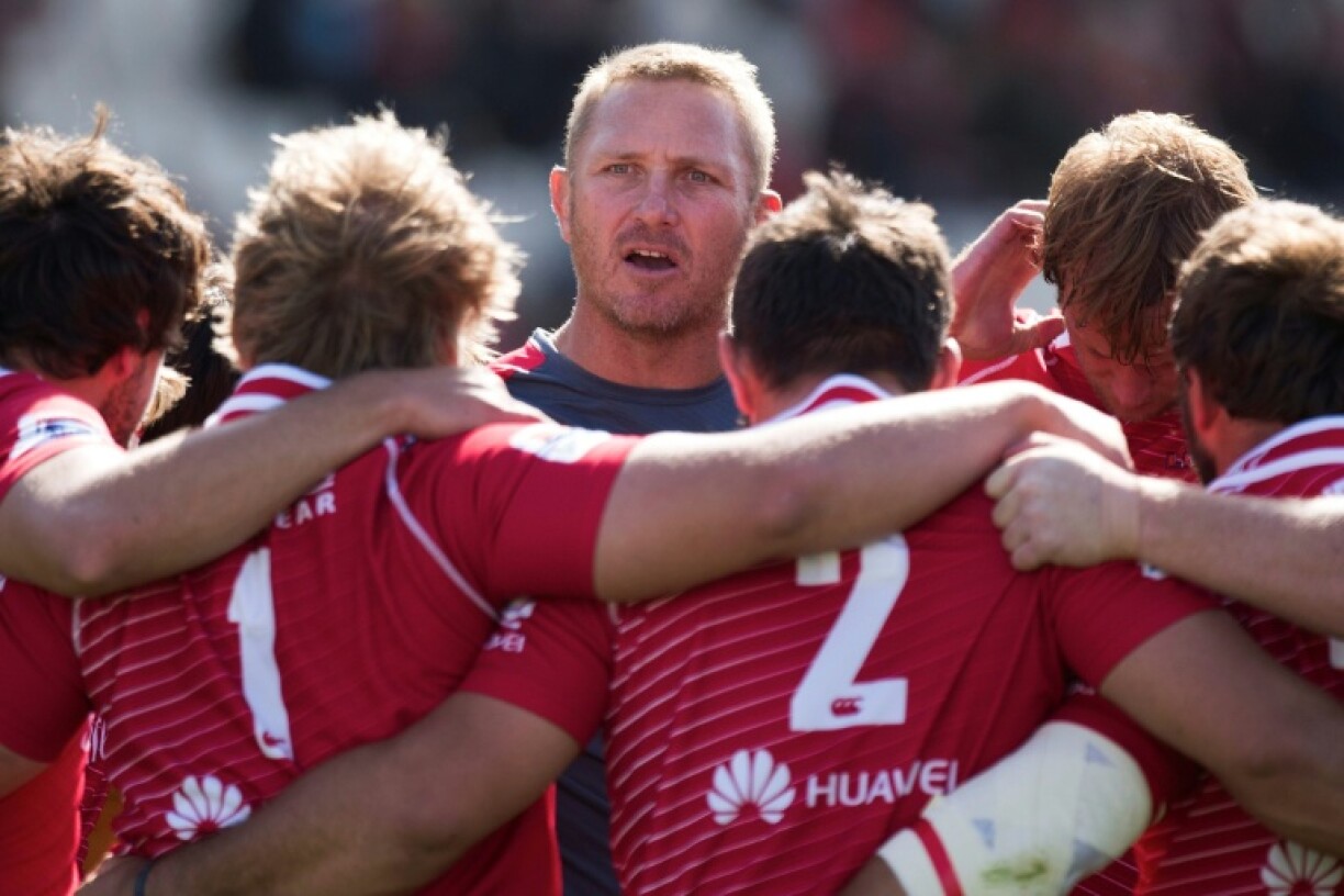 Johan Ackermann (C) gives instructions when coaching the Lions