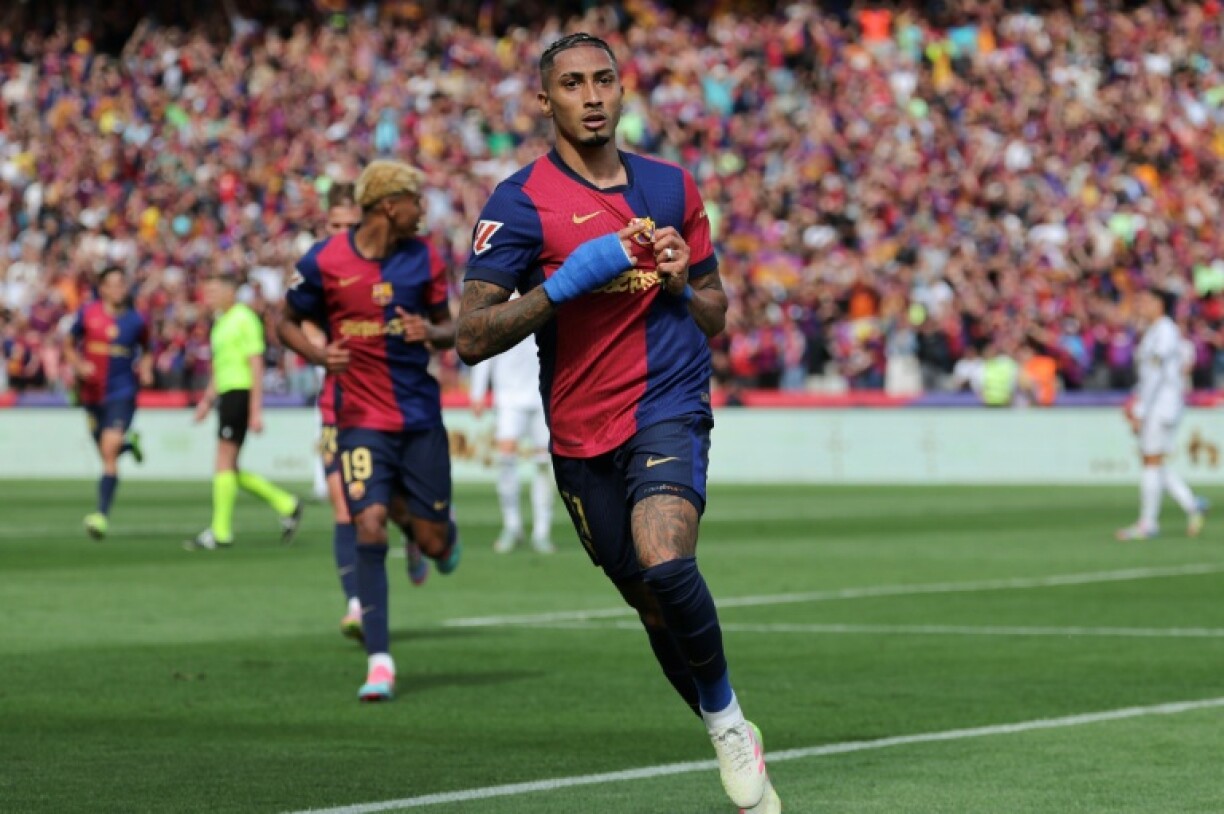 Barcelona's Brazilian forward Raphinha celebrates scoring their fourth goal against Real Madrid
