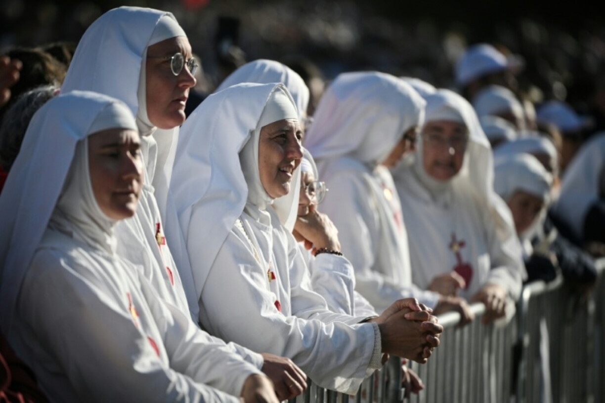 Nuns waited for the start of Sunday mass in Lourdes