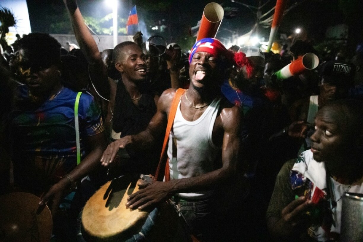 Fans celebrate in the streets of Port-au-Prince after Haiti's football team beat Nicaragua to qualify for the 2026 FIFA World Cup