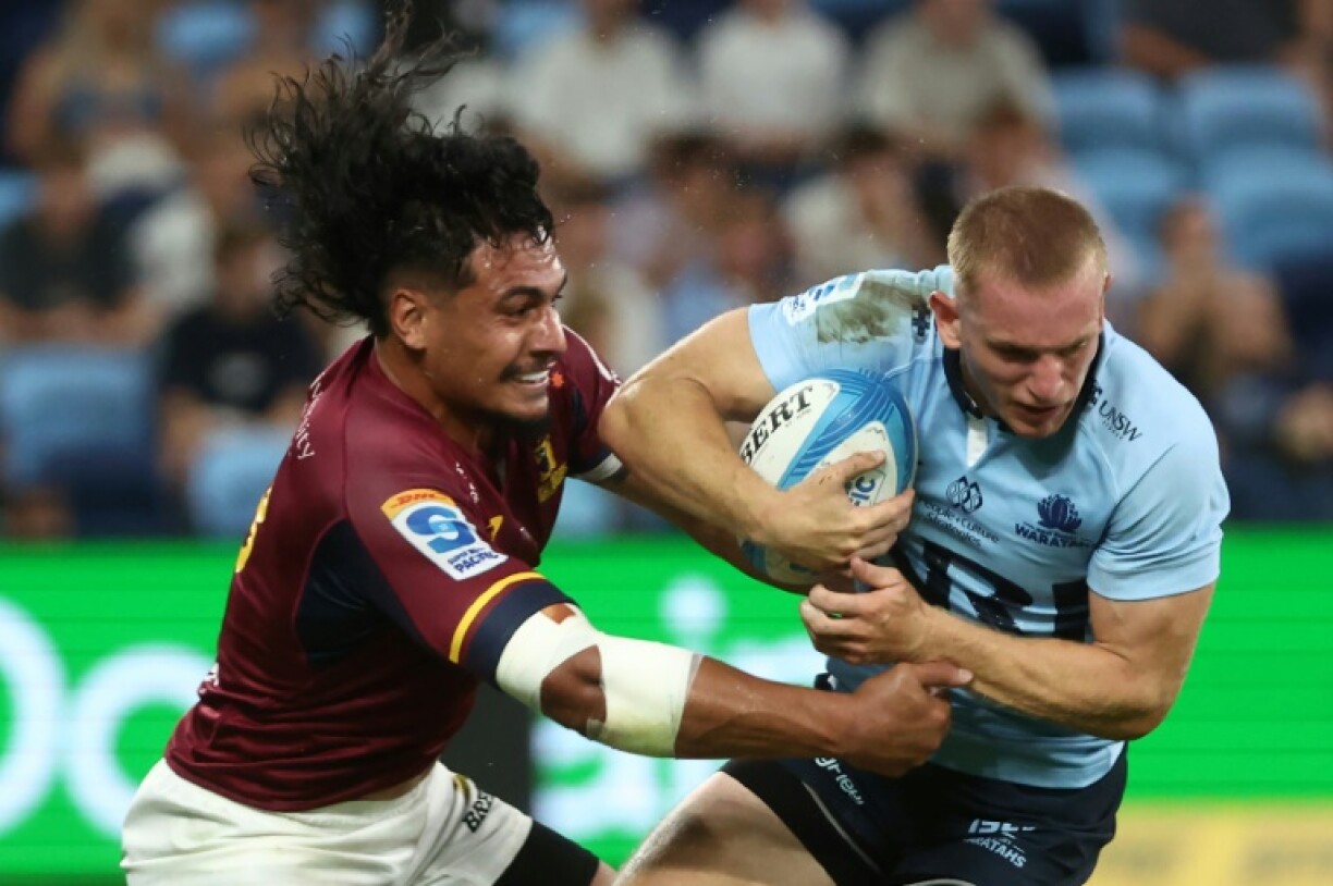 Max Jorgensen is tackled by Tanielu Tele'a of the Highlanders during their Super Rugby Pacific match in Sydney in February. The Waratahs's winger faces a lengthy spell away from the game after being injured on Friday