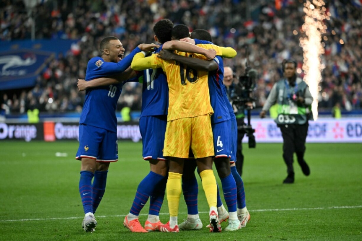 Kylian Mbappe (L) celebrates with teammates after France beat Croatia on penalties in their UEFA Nations League quarter-final