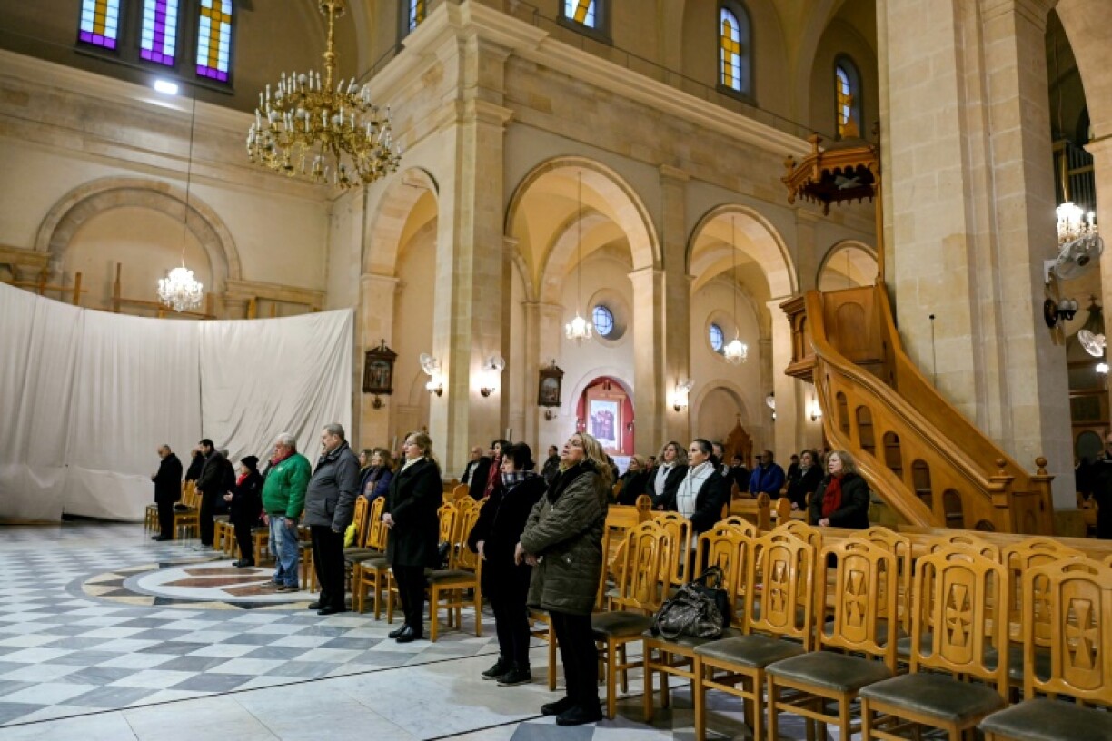 Syrian Christians attend mass at the Latin cathedral in Aleppo, uncertain what the future will hold.