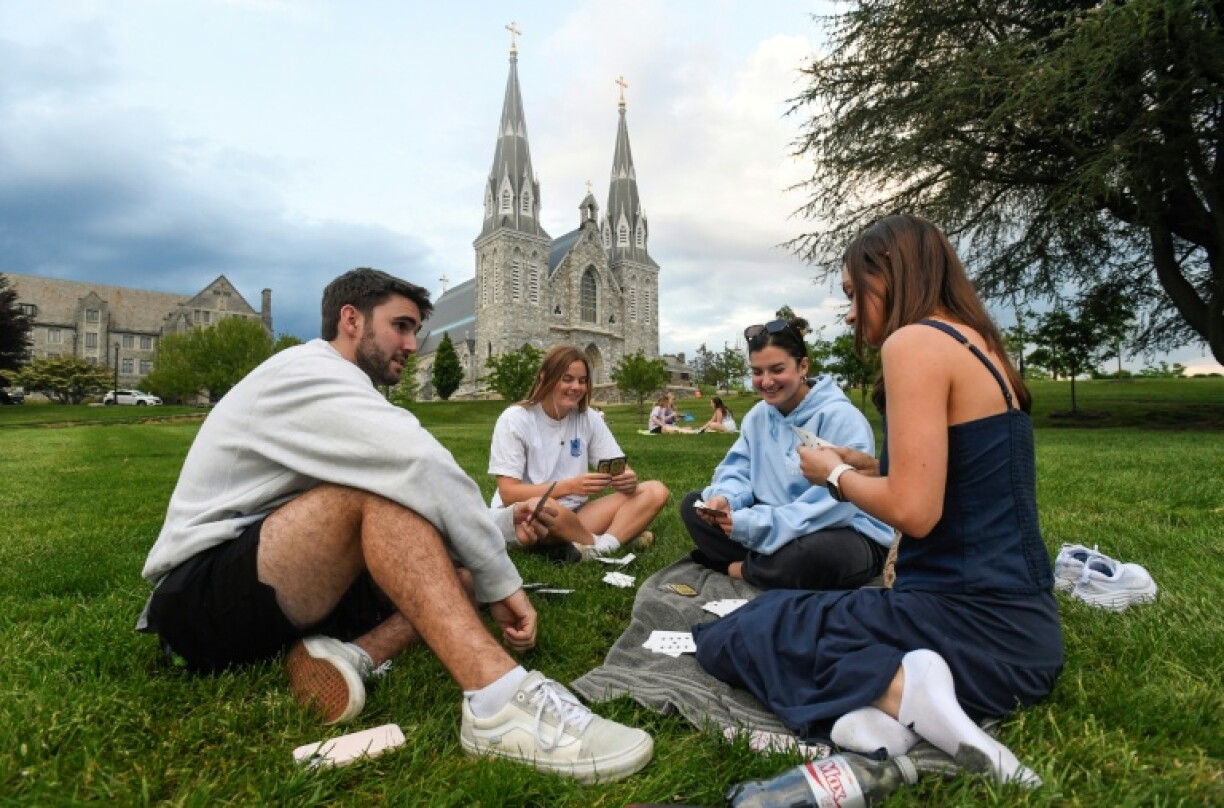 Students play cards outside of St. Thomas of Villanova Church at the campus of Villanova University in Villanova, Pennsylvania, where Pope Leo XIV studied and graduated in 1977